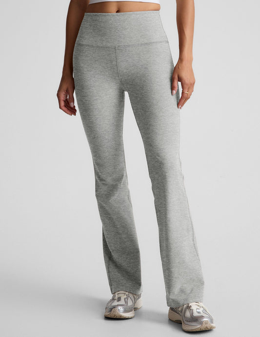 Gray marled Spacedye Practice High Waisted Bootcut Pant with a wide waistband and flared leg opening on a model.