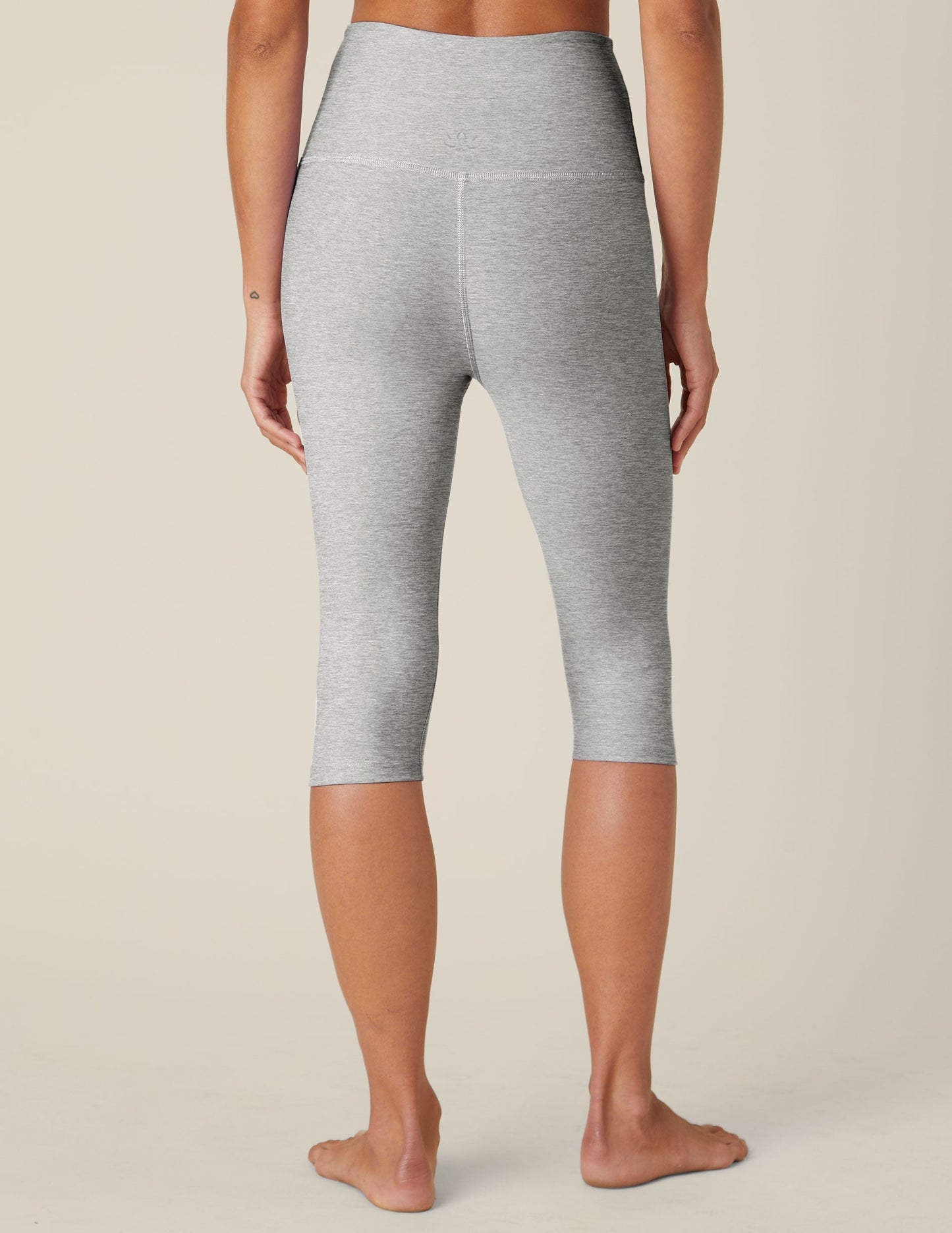 Rear view of Spacedye Pedal Pusher High Waisted Legging in marled gray, cropped below the knee with a snug fit.