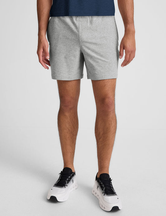 Gray marled Spacedye Unlimited Men's Short with an elastic waistband and relaxed mid-thigh fit on a model.