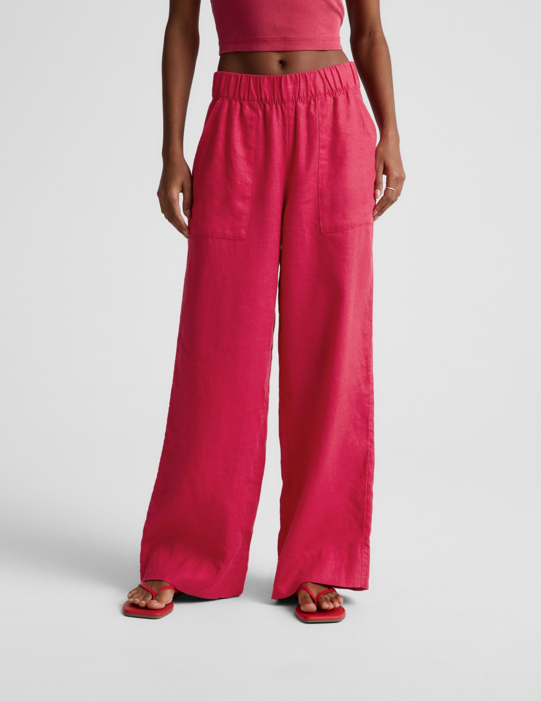 Woman wearing Pink SoftWash™ Linen Easy Wide Leg Pant 29" with a pink crop top, featuring front slant pockets.