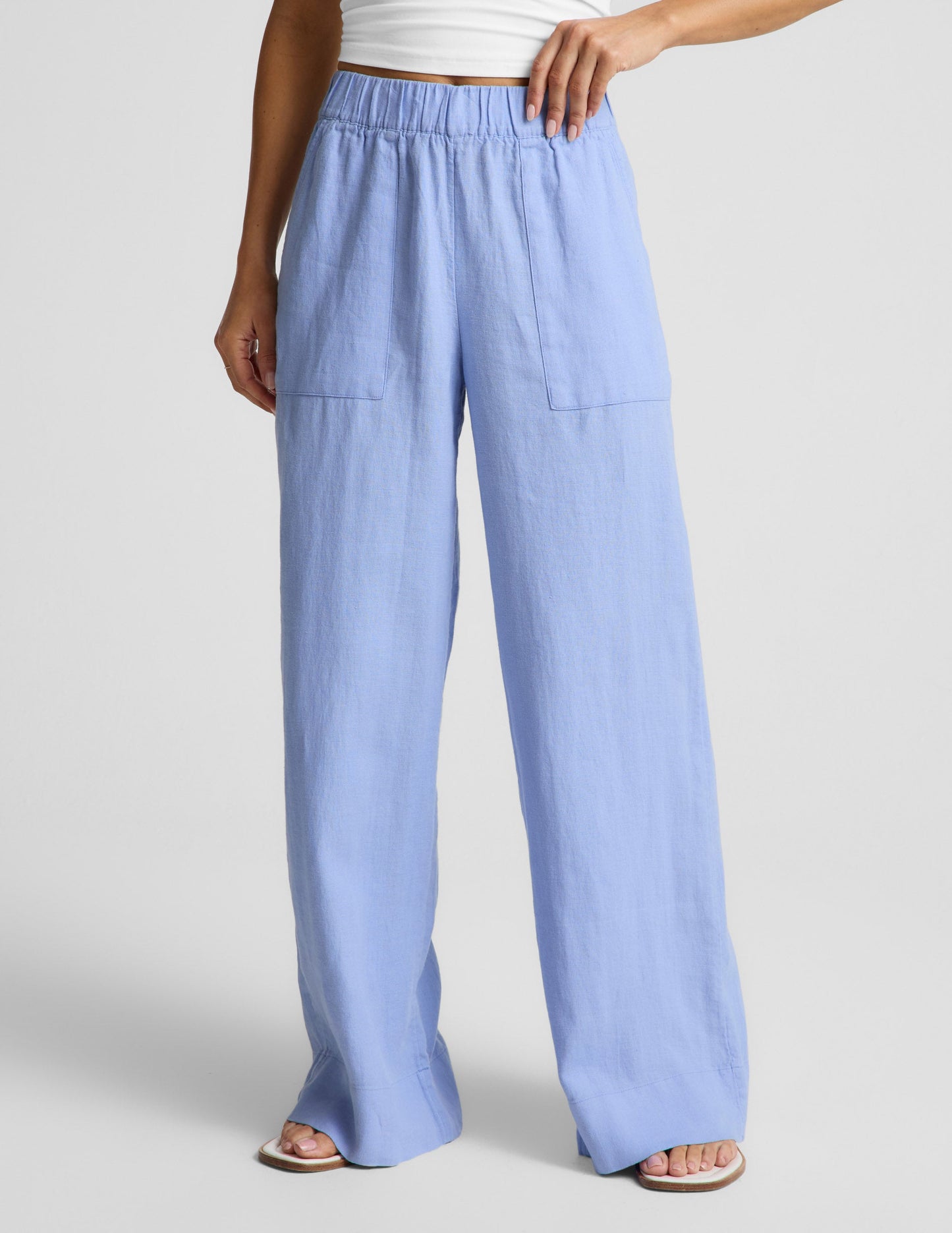 Woman wearing Blue SoftWash Linen Easy Wide Leg Pant 31" paired with a white tank top and sandals.