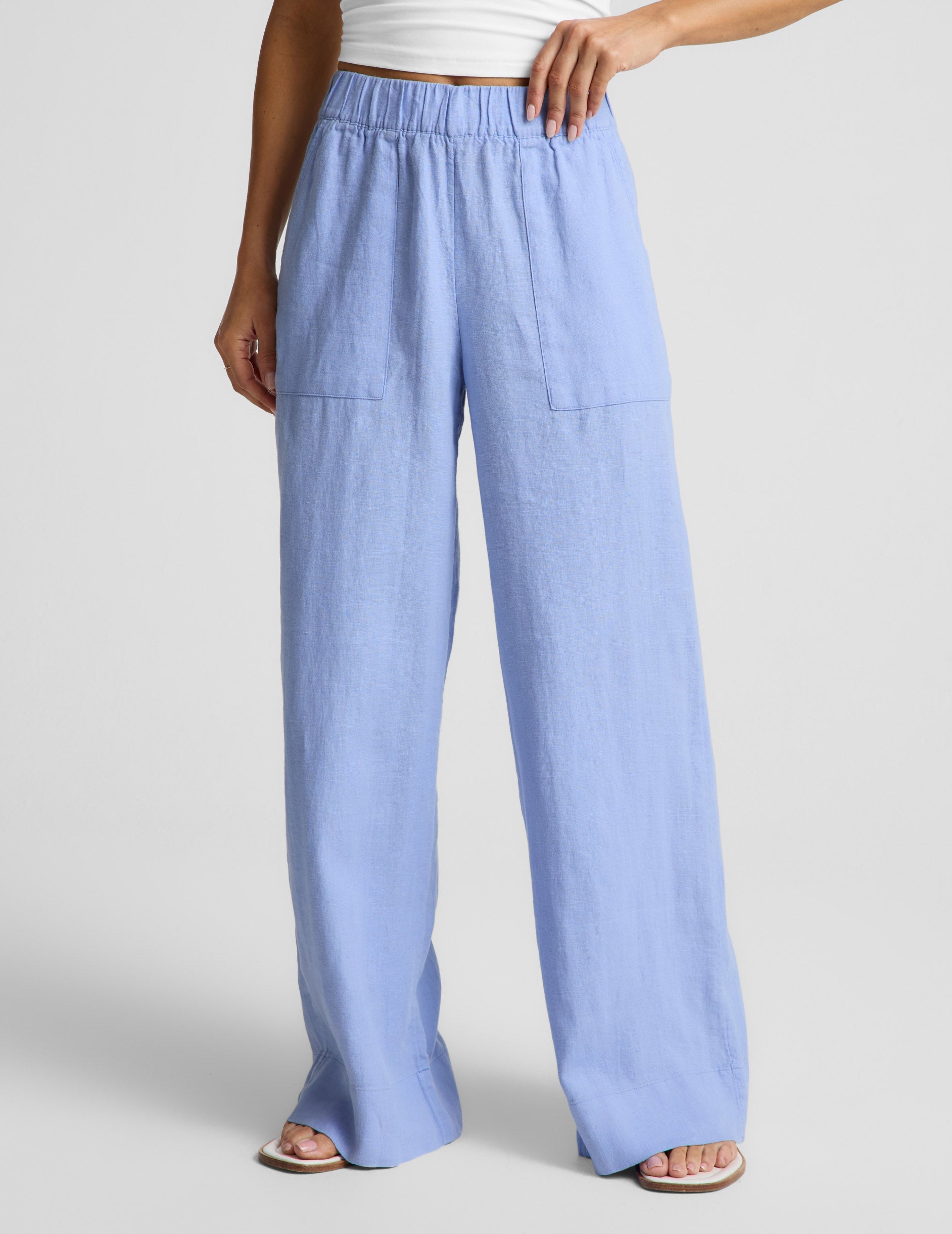 Woman wearing Blue SoftWash Linen Easy Wide Leg Pant 31" paired with a white tank top and sandals.