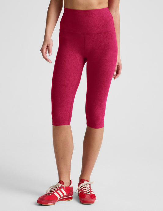 Woman wearing Fuchsia Spacedye™ Pedal Pusher High Waisted Legging with a 5” waistband paired with red sneakers.