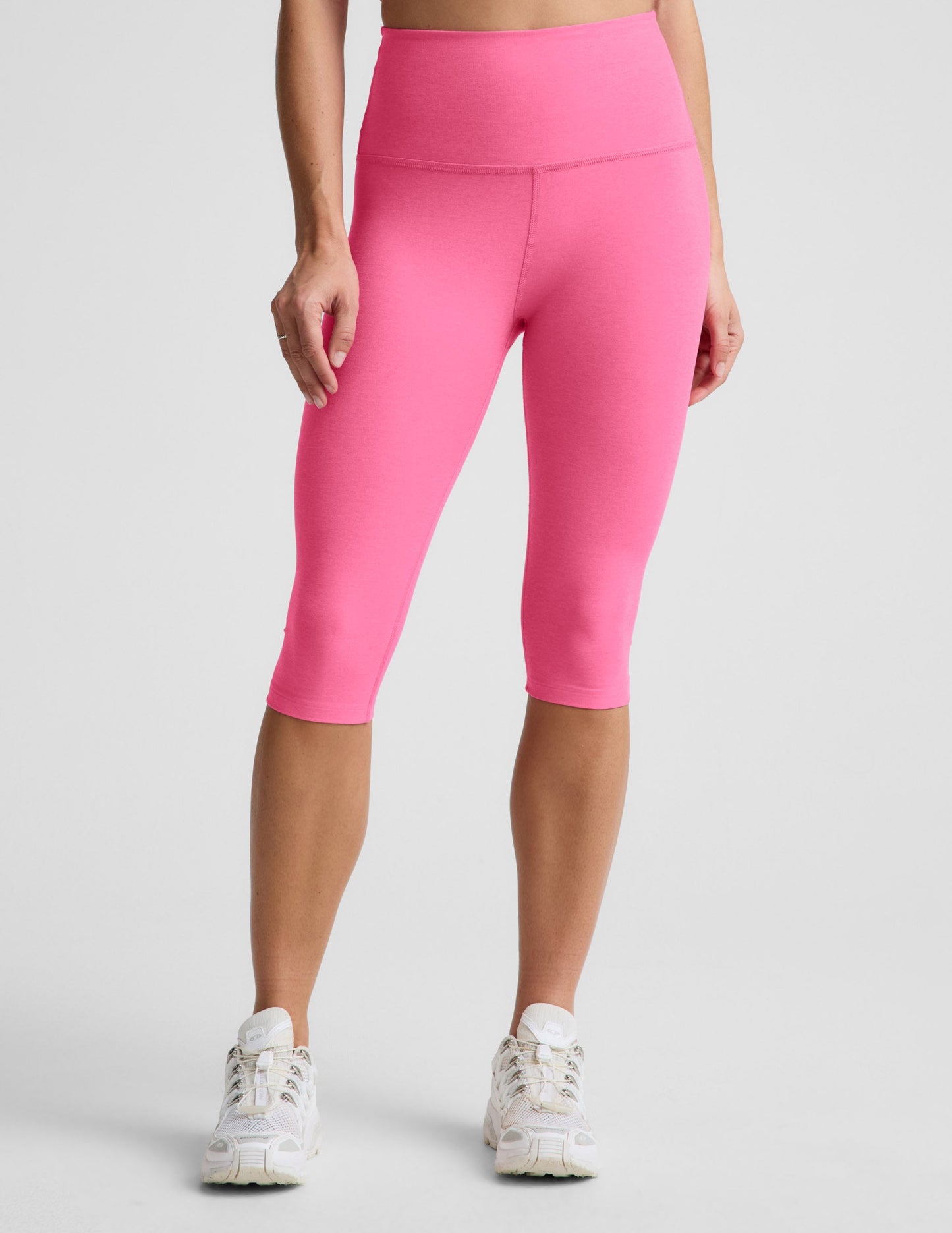 Woman wearing Pink Spacedye™ Pedal Pusher High Waisted Legging paired with white sneakers.
