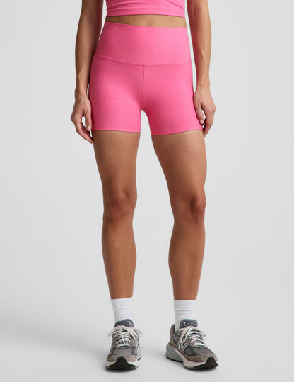 Woman wearing Pink Spacedye™ Keep Pace 3" Short paired with a matching crop top, featuring a high waistband and snug fit.