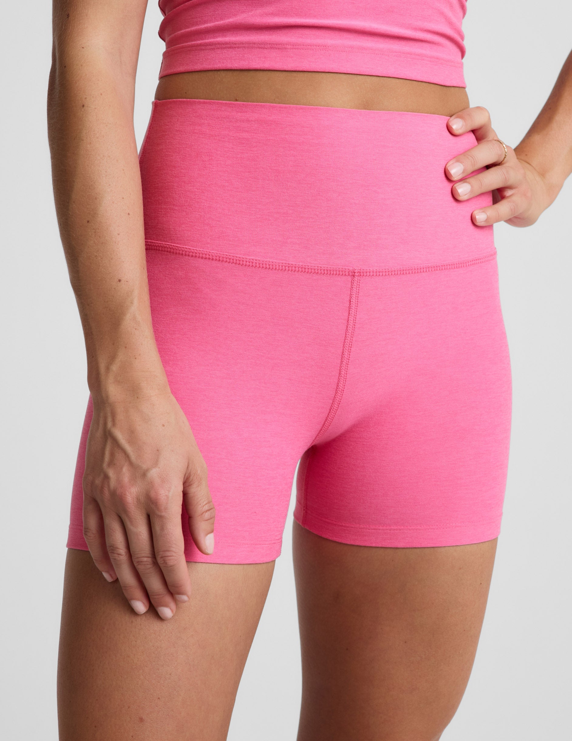 Woman wearing Pink Spacedye™ Keep Pace 3" Short paired with a matching pink crop top.