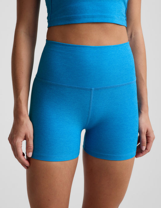 Woman wearing Blue Spacedye™ Keep Pace 3" Short featuring a high waistband paired with a matching crop top.