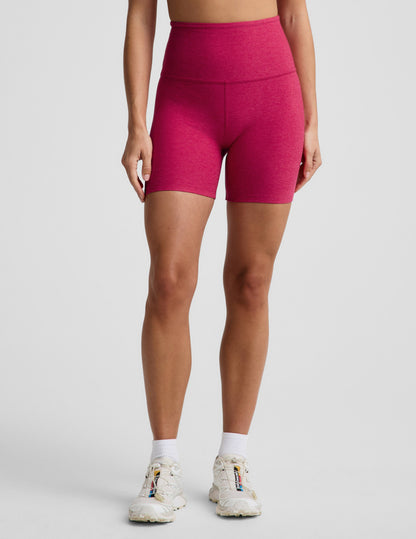 Woman wearing Fuchsia Spacedye™ Keep Pace 5" Biker Short paired with white crew socks and cream athletic sneakers.