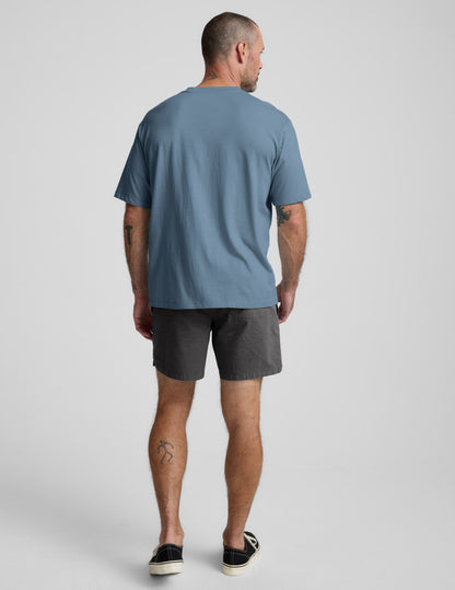 Rear view of a man wearing dark gray Saturday Men's Shorts, featuring a regular fit and mid-thigh length.