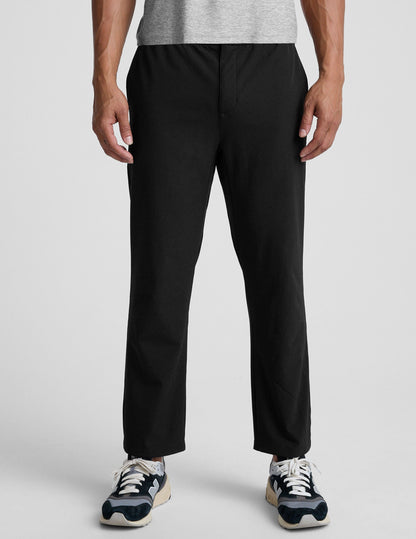 Front view of the black Dynamic Men's Straight Leg Pant featuring a relaxed fit, straight leg, and ankle-length hem on a model.