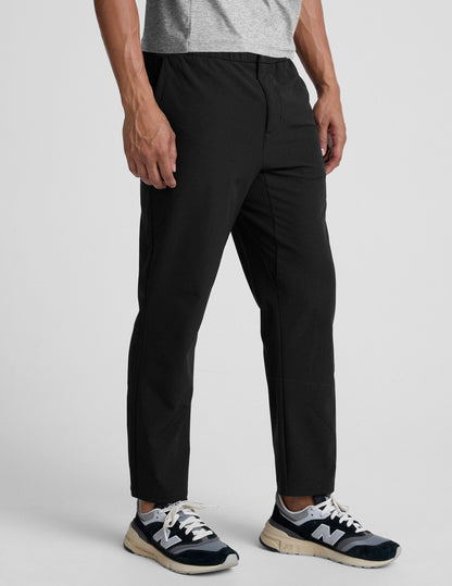 Black Dynamic Men's Straight Leg Pant featuring a relaxed fit, elastic waist, and ankle-length hem shown on a model.