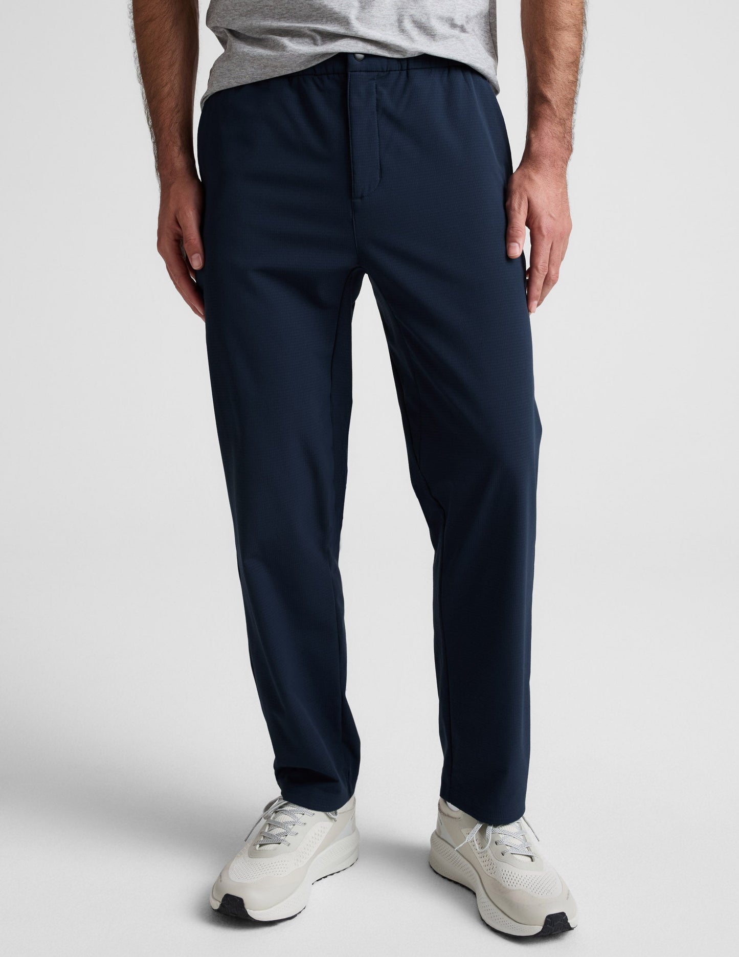 Front view of navy Dynamic Men's Straight Leg Pant featuring a relaxed fit, elastic waistband, and a single snap closure.