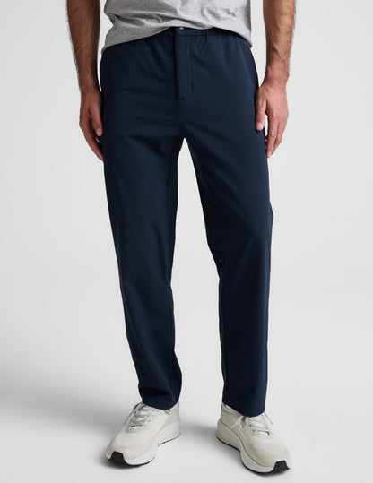 Front view of navy Dynamic Men's Straight Leg Pant featuring a relaxed fit, elastic waistband, and a single snap closure.