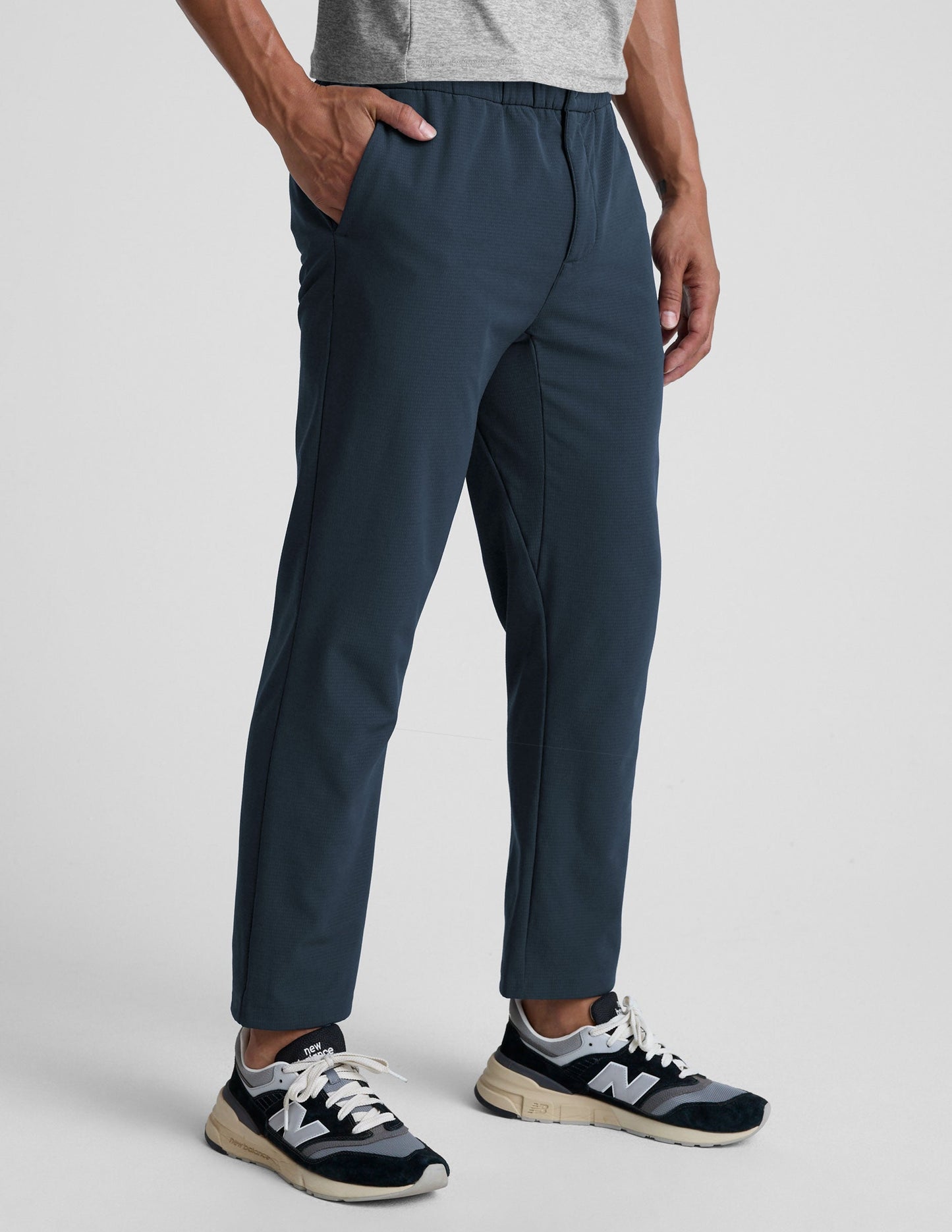 Navy blue Dynamic Men's Straight Leg Pant on a model, featuring a relaxed fit, straight leg, and elastic waistband.