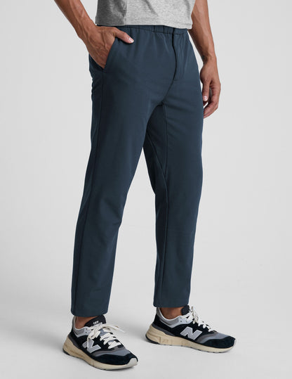 Navy blue Dynamic Men's Straight Leg Pant on a model, featuring a relaxed fit, straight leg, and elastic waistband.