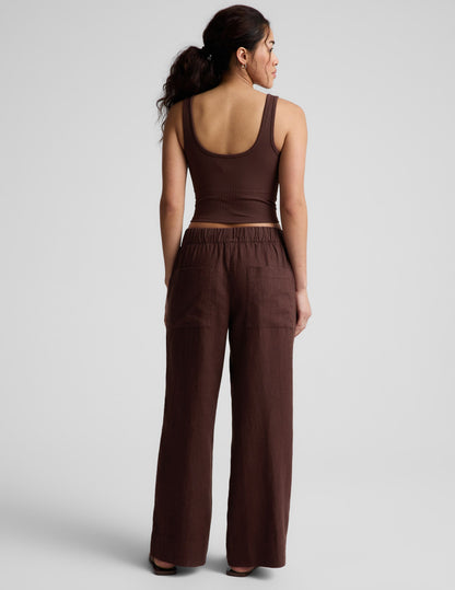 Rear view of brown SoftWash Linen Easy Wide Leg Pant featuring a gathered elastic waistband and relaxed wide-leg silhouette.