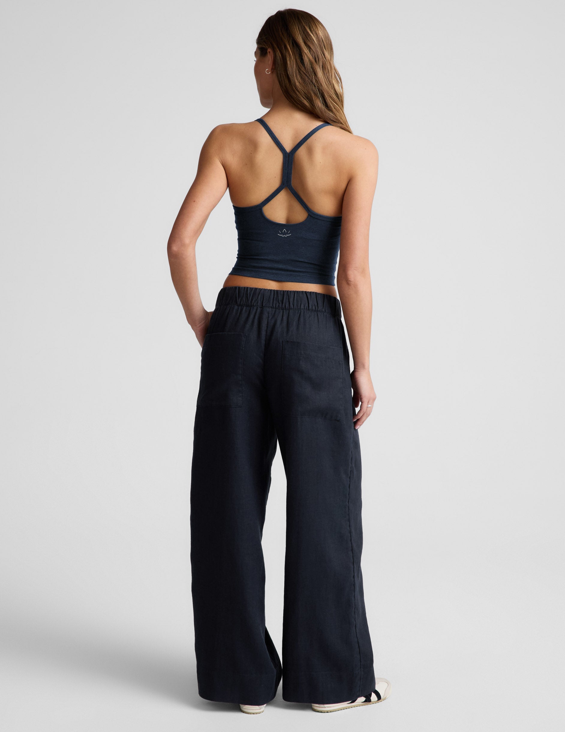 Rear view of navy SoftWash Linen Easy Wide Leg Pant featuring an elastic waistband, back pockets, and a relaxed wide-leg fit.
