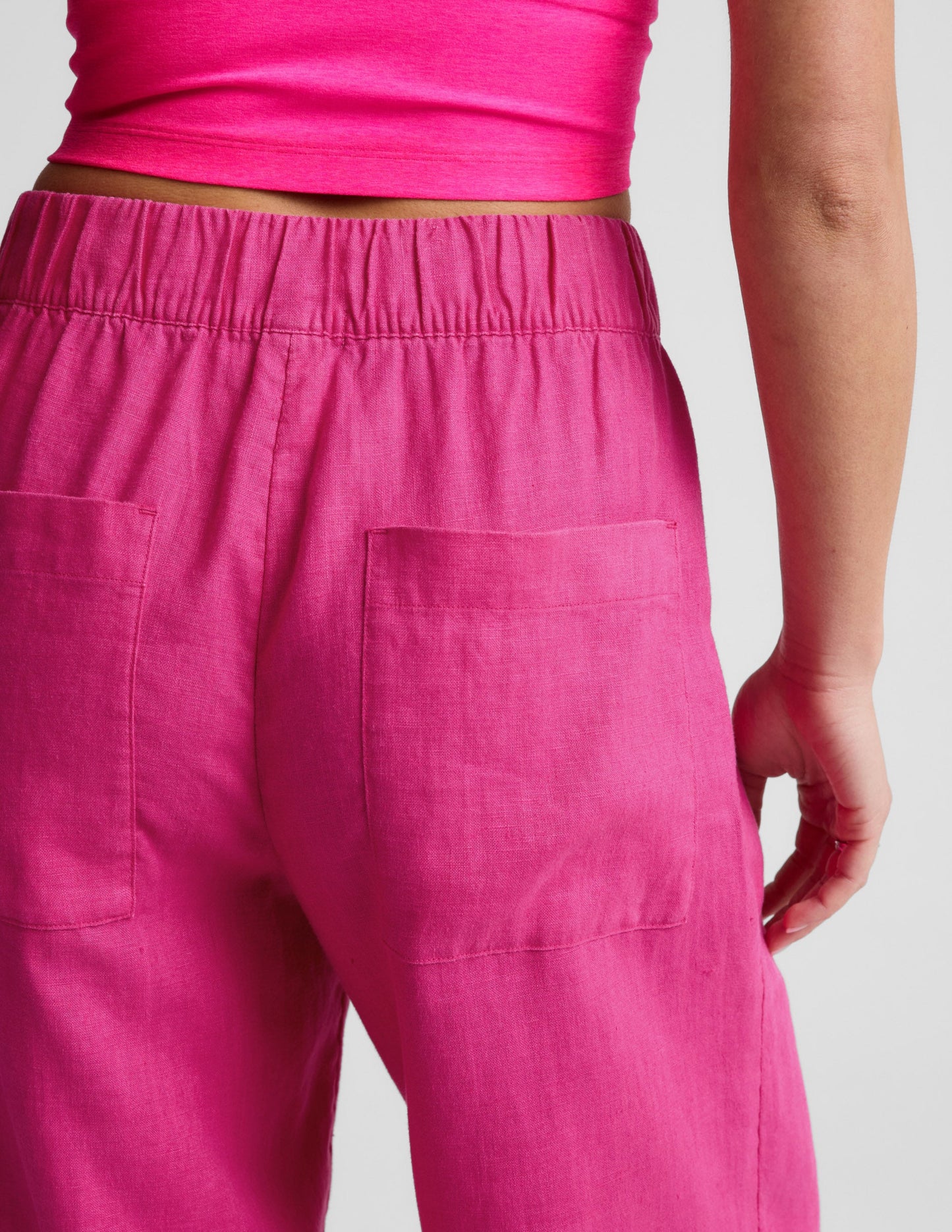 Rear view of fuchsia SoftWash Linen Easy Wide Leg Pant with a gathered elastic waistband and two back pockets.