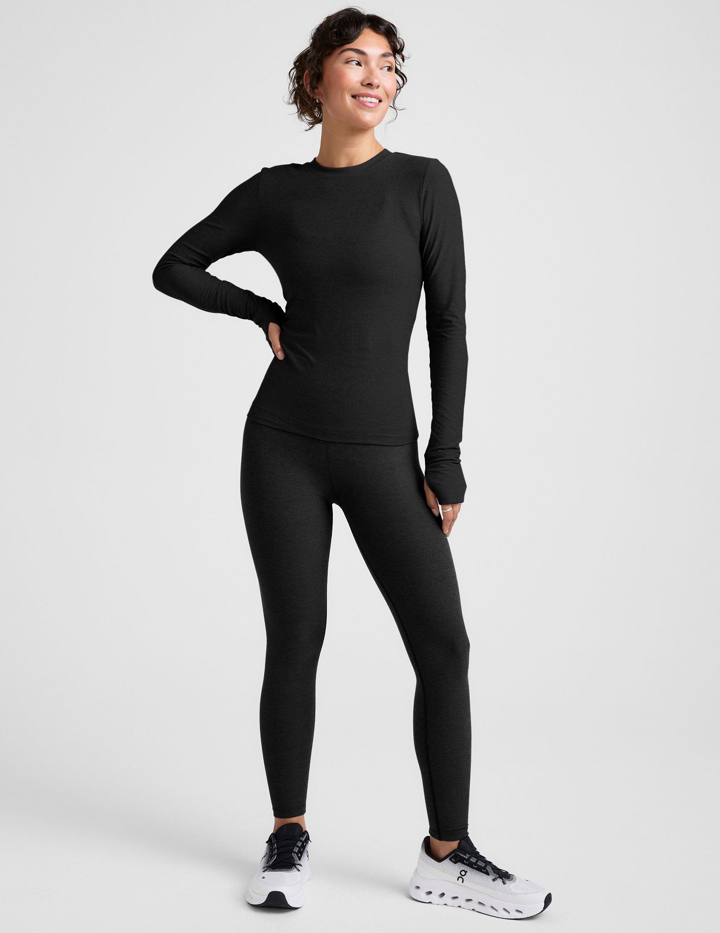 black crew neck long sleeve with thumb holes.