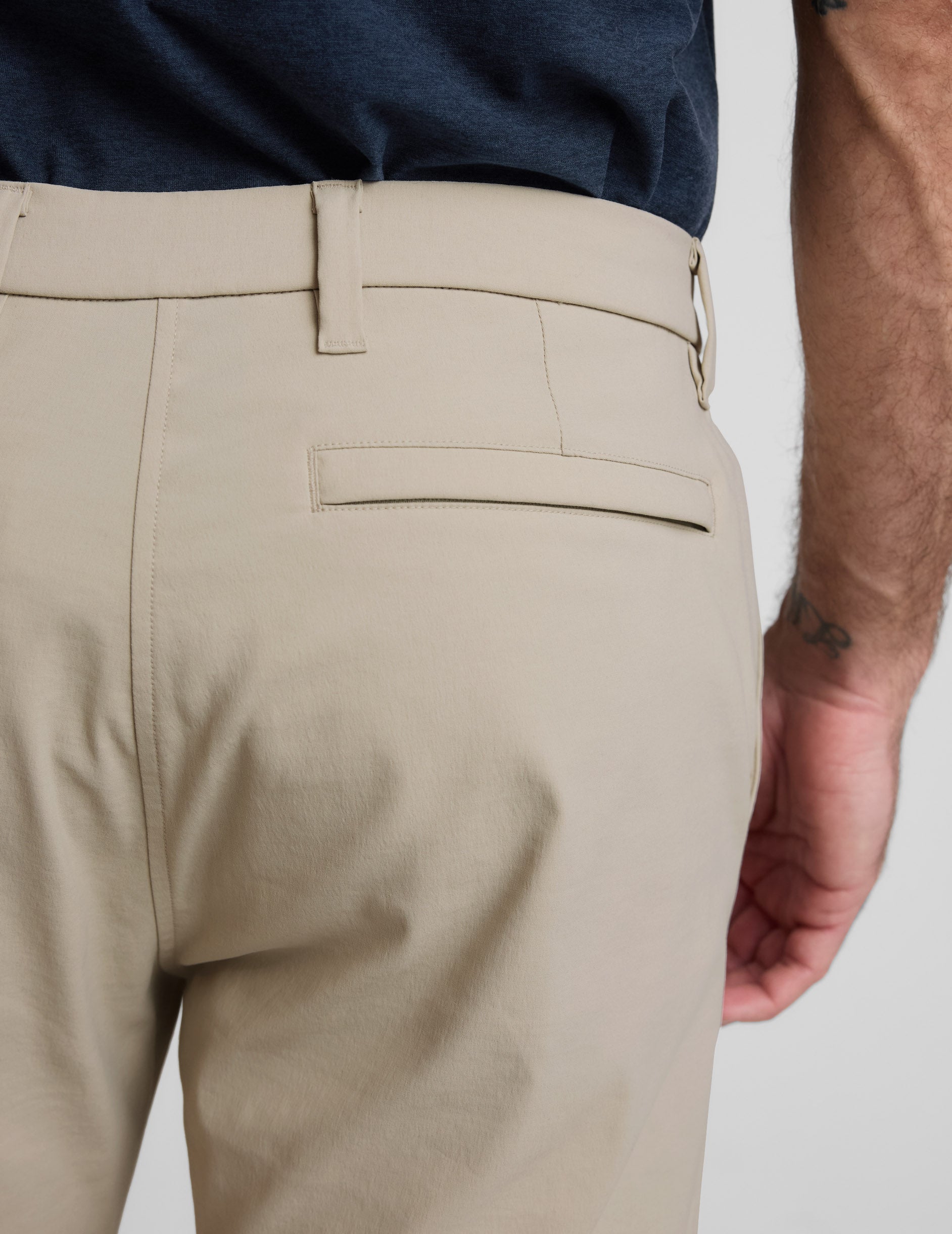 Rear close-up of cream Element Men's Chino Trouser showing the waistband, belt loops, and horizontal back welt pocket.