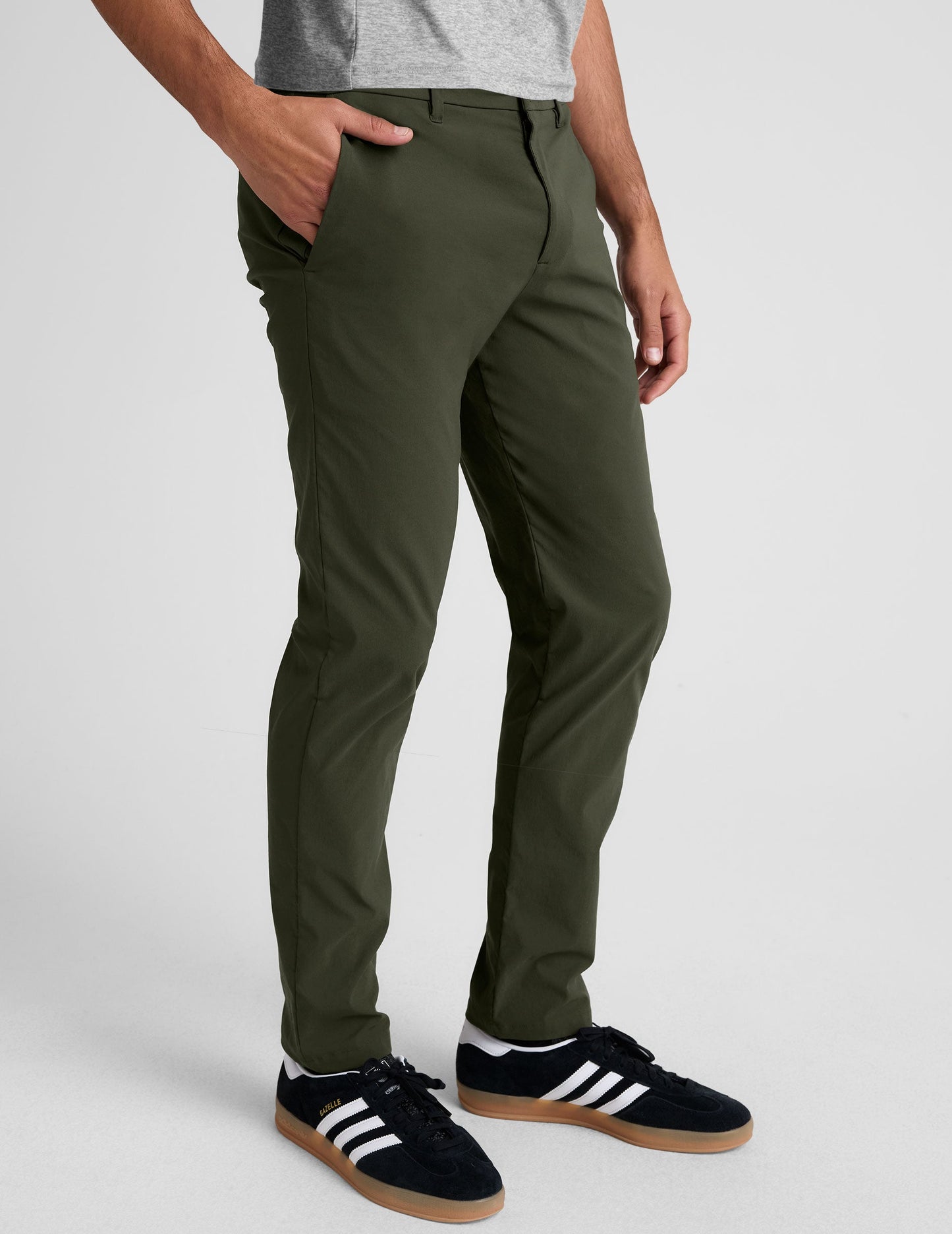 Essential Men's Chino 30" Trouser in dark olive green with a slim fit, side pockets, and belt loops on a model.