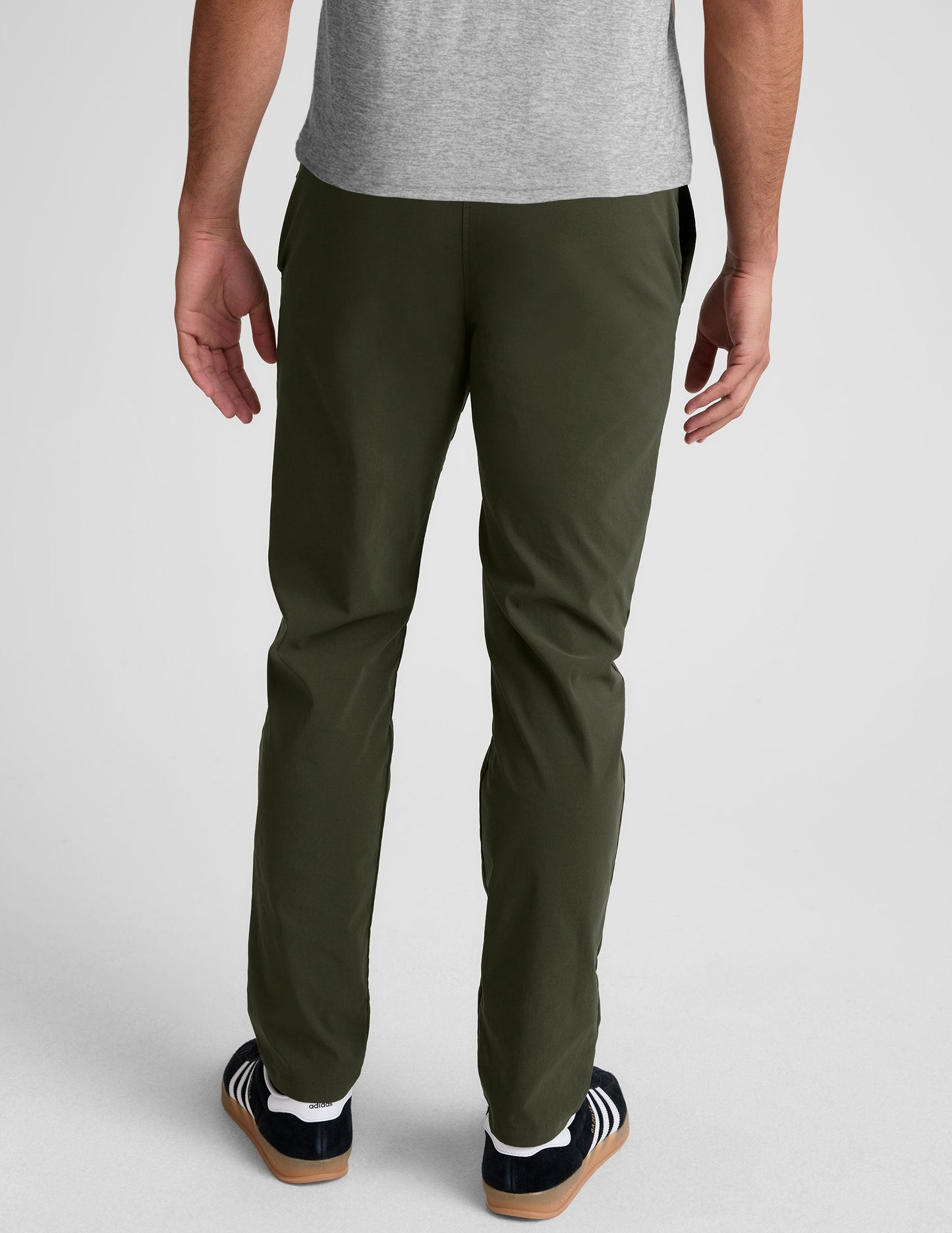 Rear view of dark green Essential Men's Chino 30" Trouser featuring back welt pockets, belt loops and a straight leg fit.