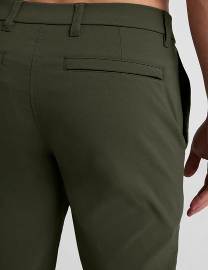 Rear view of olive green Essential Men's Chino 30" Trouser highlighting the waistband, belt loops, and welt pocket.