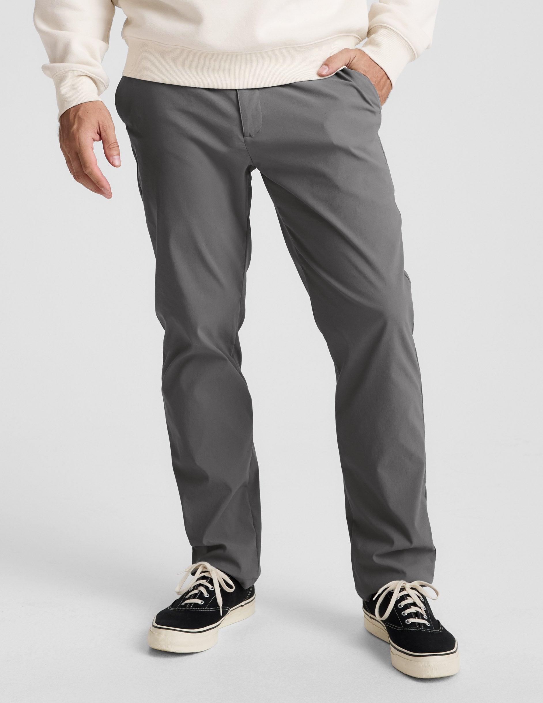 Grey Element Men's Chino Trouser, a slim-fit straight-leg pant worn with a cream sweater and black sneakers.