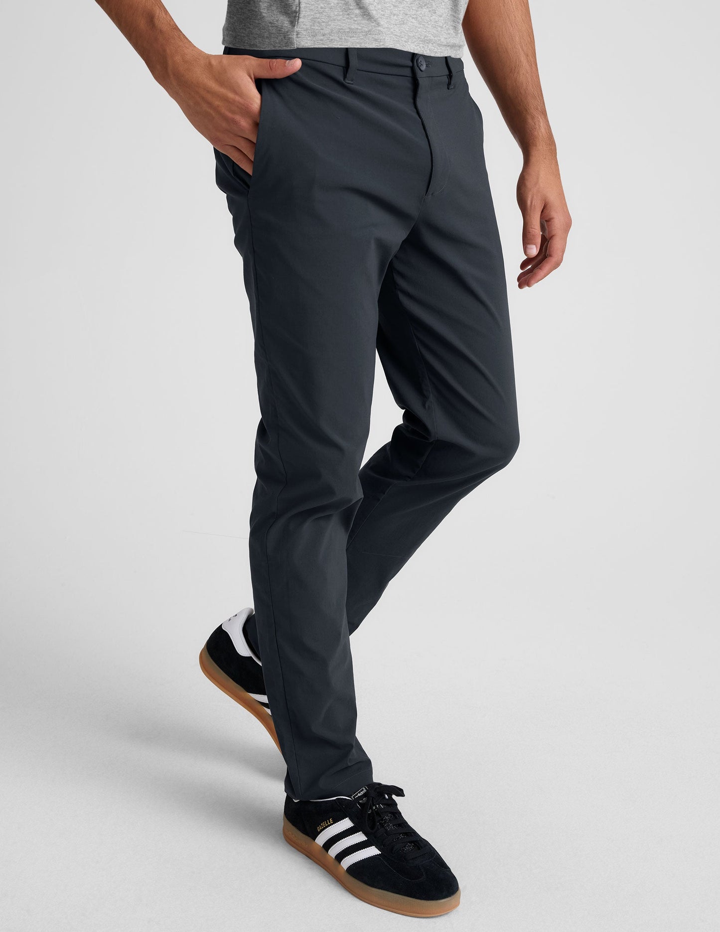 Dark gray Essential Men's Chino 32" Trouser featuring a straight leg, belt loops, and side pockets on a walking model.