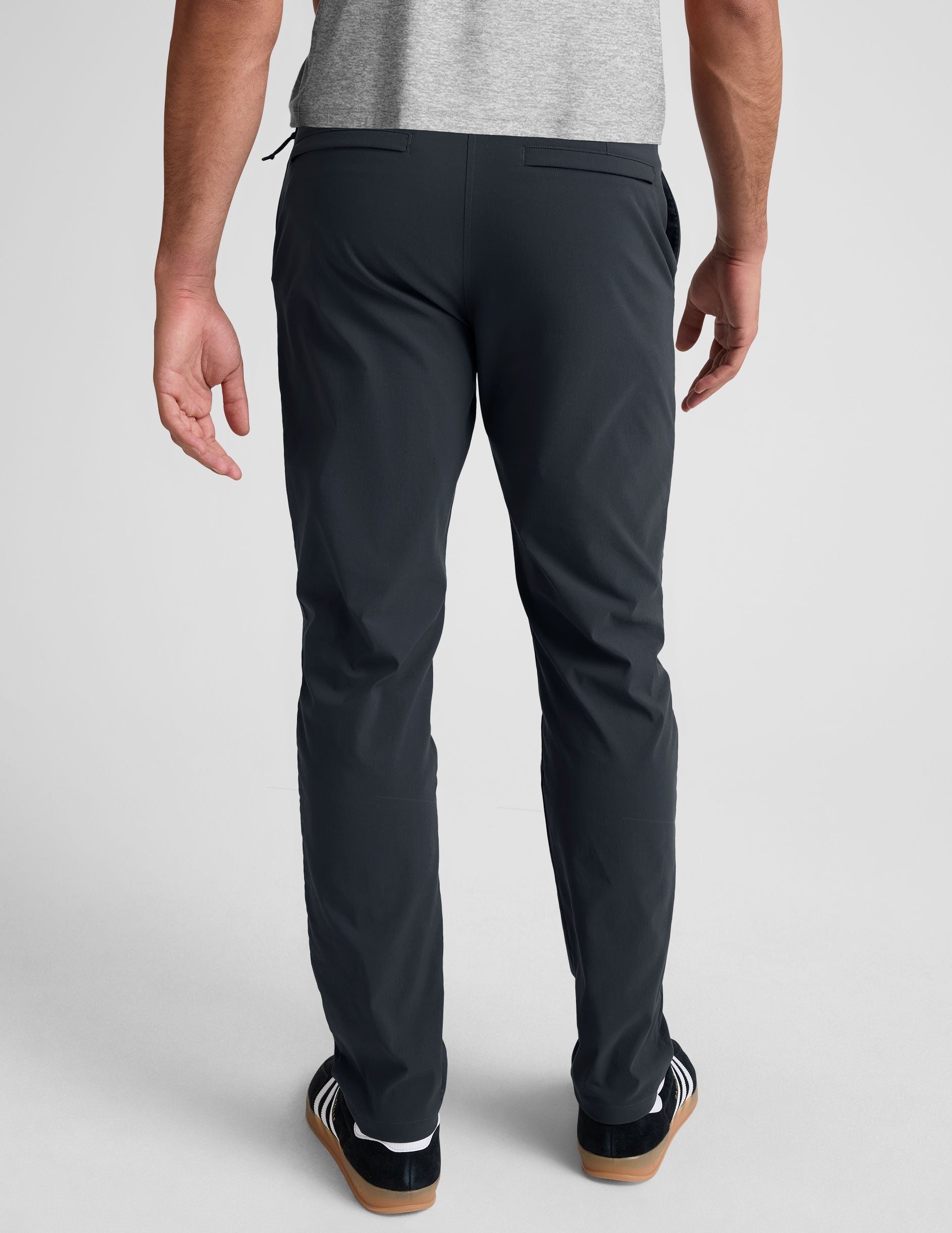 Back view of Essential Men's Chino 32" Trouser in dark gray, featuring a straight leg fit, belt loops, and welt pockets.