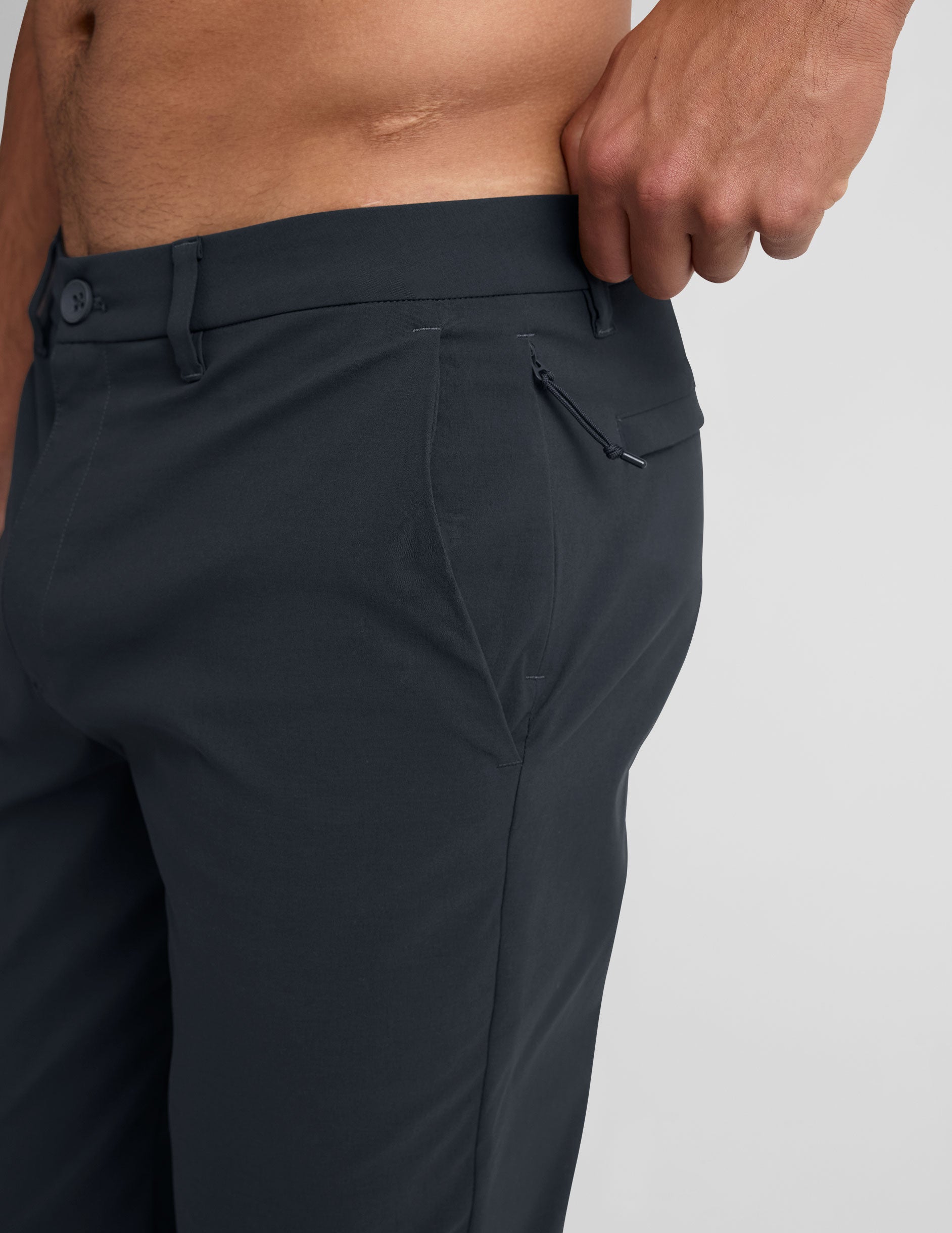 Close-up side view of Essential Men's Chino 32" Trouser in gray, showing belt loops, side pocket, and hidden zipper pocket.