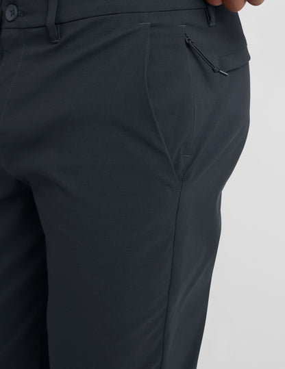 Close-up of Essential Men's Chino 30" Trouser in dark gray featuring belt loops, slant pocket, and side zipper detail.