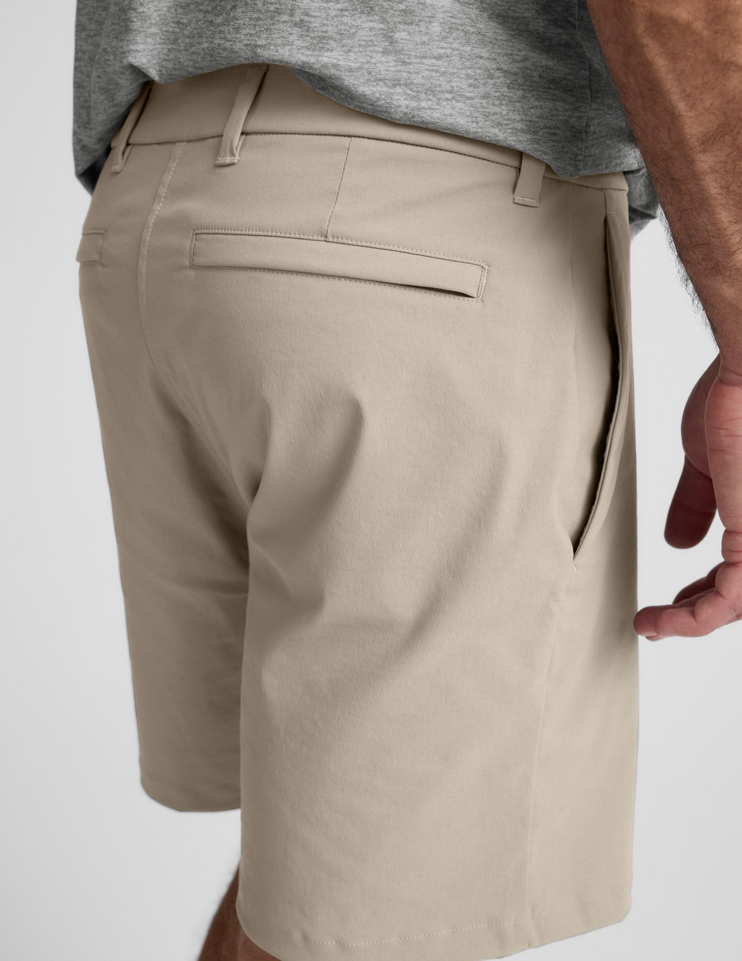 Side-back view of beige Element Men's Chino Short 7" featuring belt loops, a welt back pocket, and a side seam pocket.