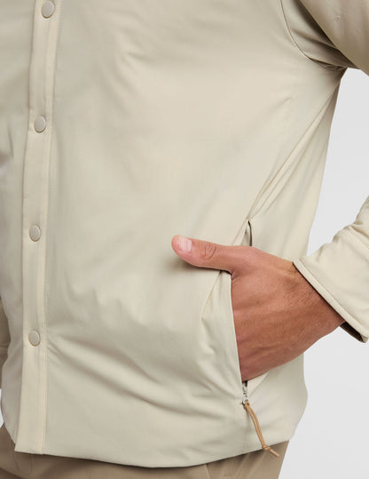 brown men's button up insulated jacket with a shirt collar and side seam invisible zipper pockets.