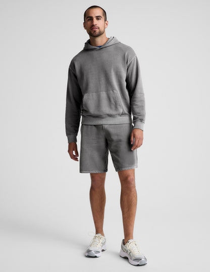 Man wearing Gray Beach Washed Terry Men's Short™ paired with a matching gray hoodie and white sneakers.