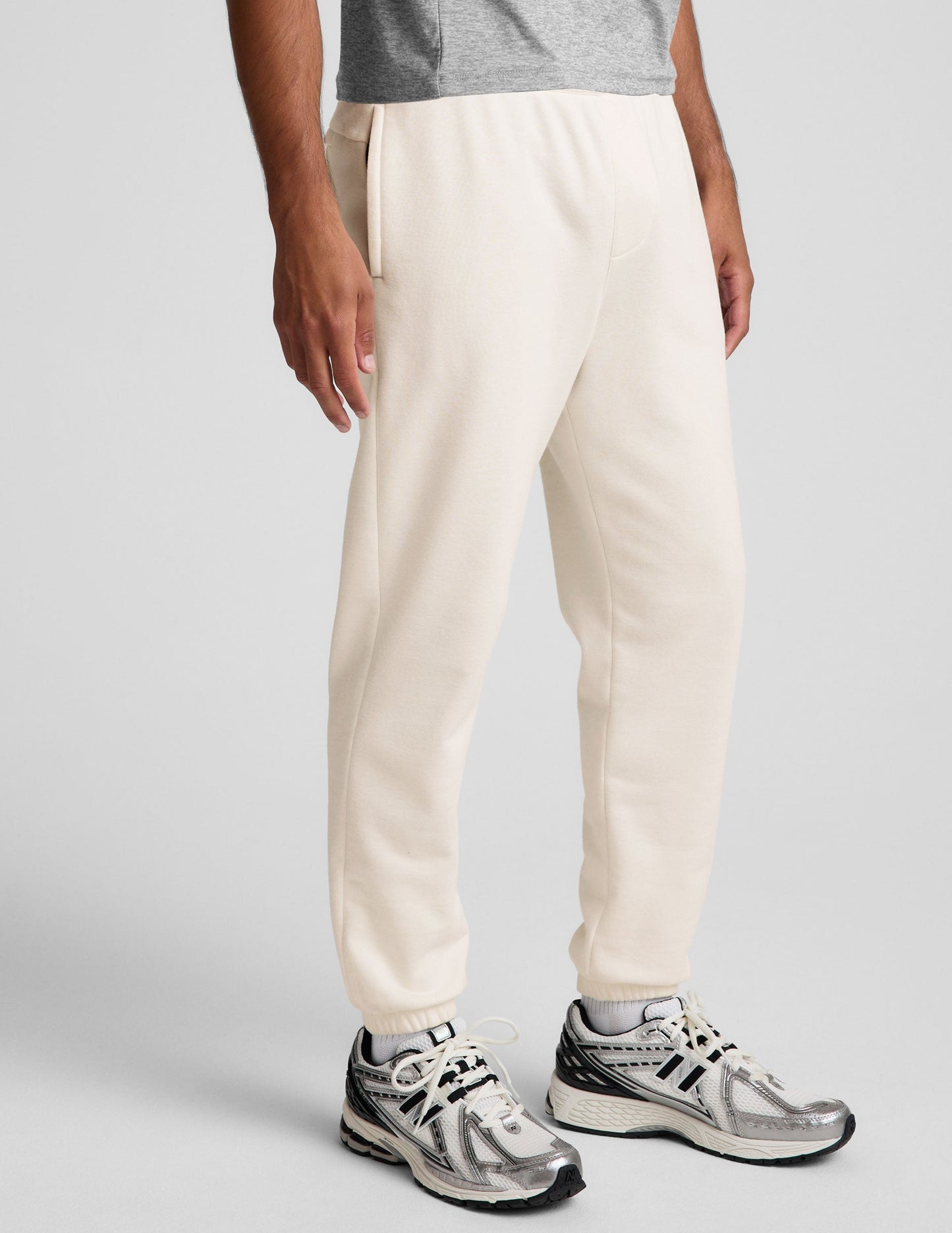 Classic Fleece Men's Jogger in cream featuring a relaxed fit, side pockets, and elasticized cuffs.
