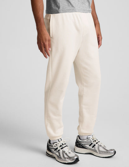 Classic Fleece Men's Jogger in cream featuring a relaxed fit, side pockets, and elasticized cuffs.