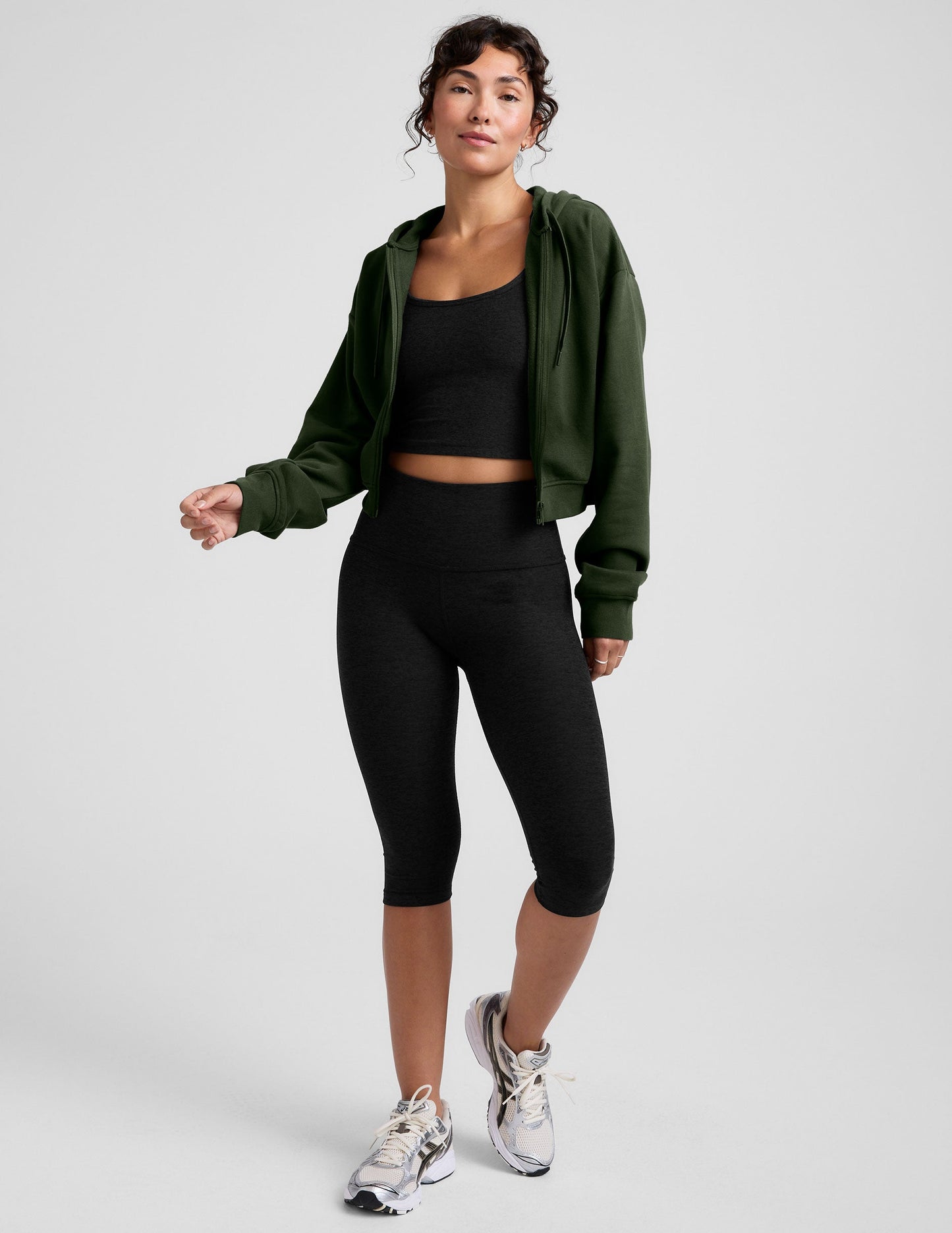 green fleece zip-up jacket with a drawstring hood.