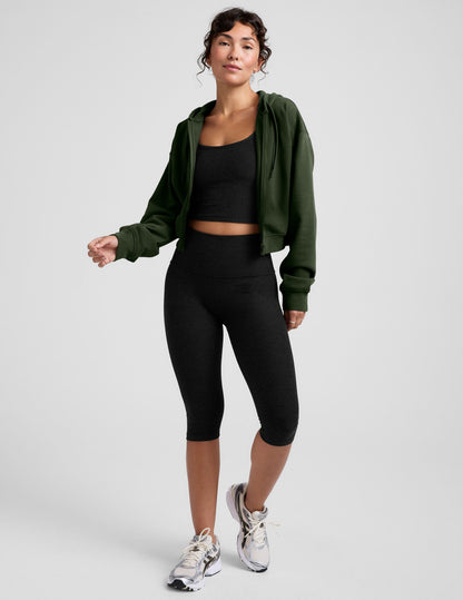 green fleece zip-up jacket with a drawstring hood.