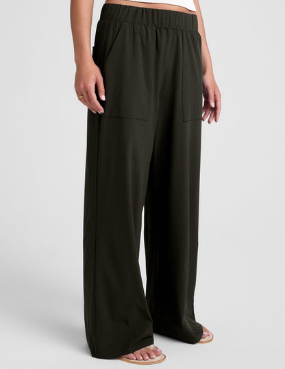 Mid-rise Easy Wide Leg Pant in dark green with an elastic waistband, front patch pockets, and a relaxed full-length fit.