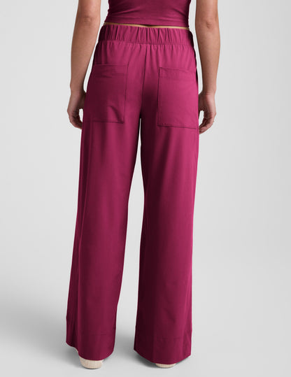 Rear view of Woman wearing Maroon Easy Wide Leg Pant 31"™ paired with a matching maroon crop top.