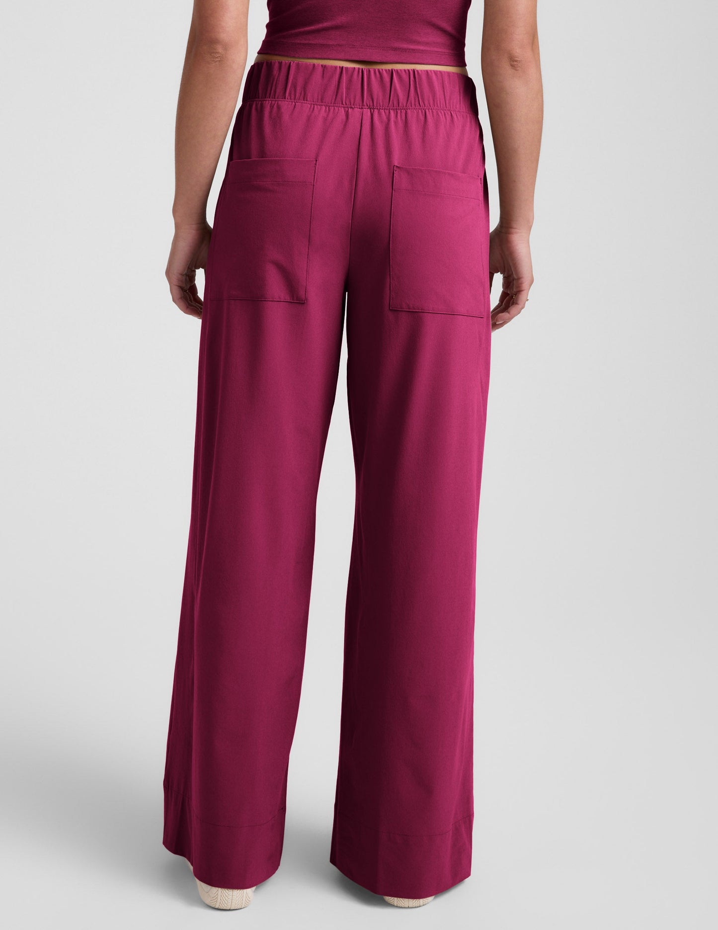 Rear view of Woman wearing Maroon Easy Wide Leg Pant 31"™ paired with a matching maroon crop top.