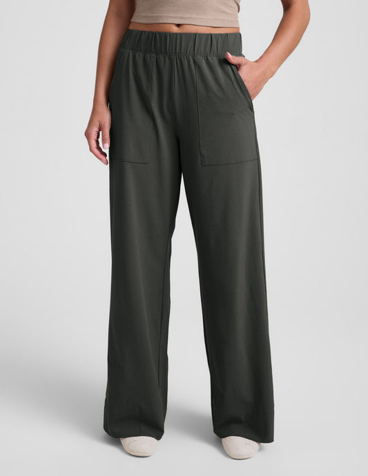 Easy Wide Leg Pant 31" in dark olive, featuring a relaxed wide-leg silhouette, elastic waistband, and large front pockets.