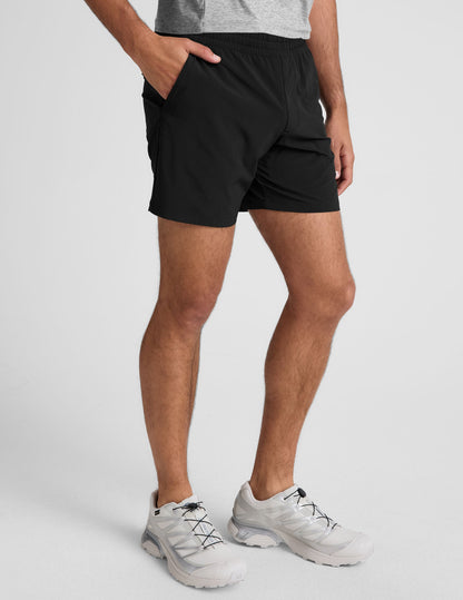 Pivotal 2.0 Men's Short 7" in black with a straight silhouette, mid-thigh length, and elastic waistband on a model.