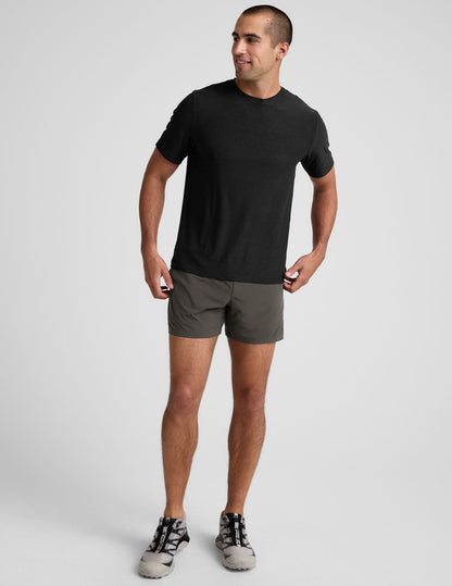 Front view of a man wearing gray Pivotal 2.0 Men's Lined Short 5" with a relaxed fit and elastic waistband.