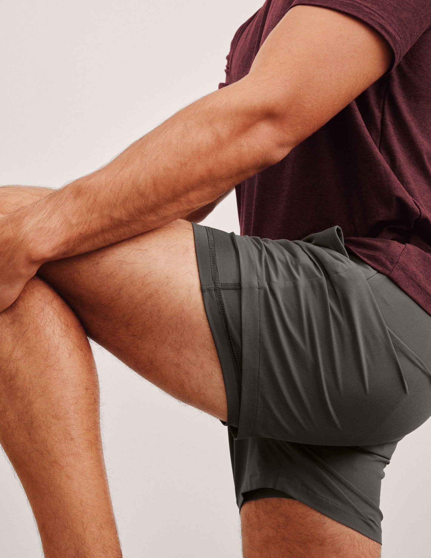 grey men's 5" shorts on a plain background.