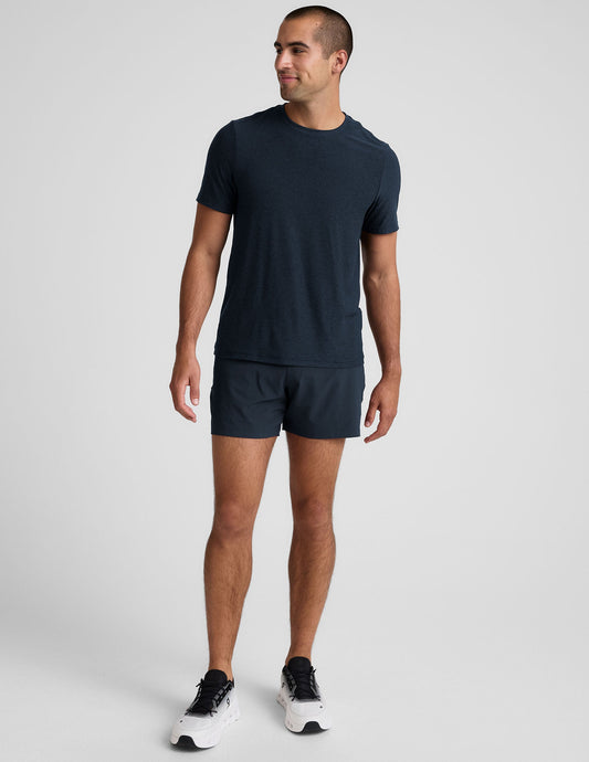 Front view of a man wearing navy Pivotal 2.0 Men's Lined Short 5" with a relaxed fit and mid-thigh length.