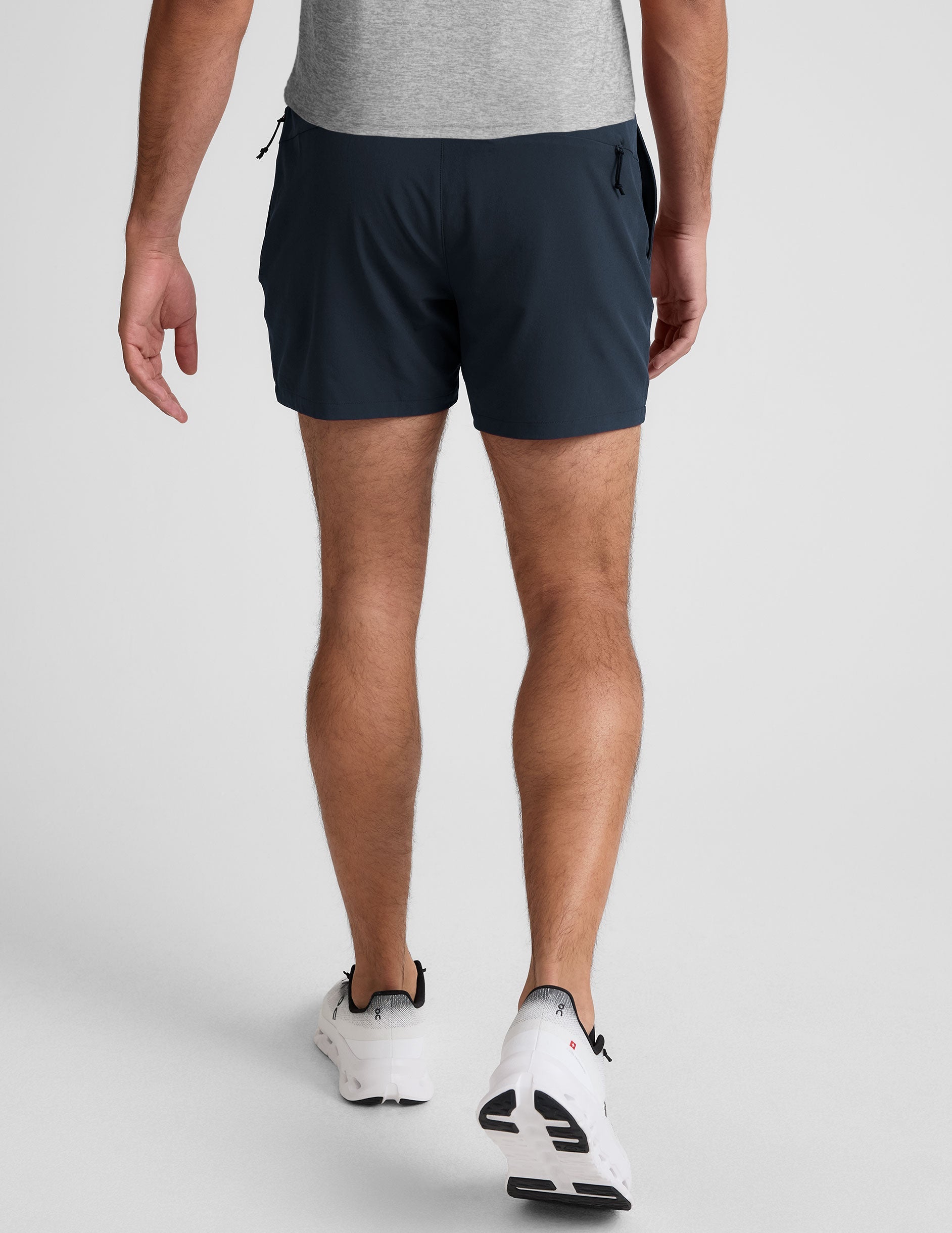 Rear view of navy Pivotal 2.0 Men's Lined Short 5" featuring an elastic waistband and mid-thigh running fit.