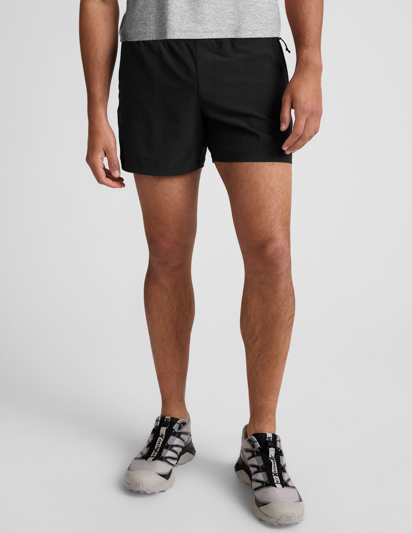 Front view of black Pivotal 2.0 Men's Lined Short 5" with elastic waistband on a model from the waist down.