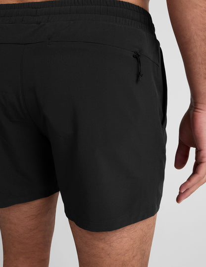 Rear view of Pivotal 2.0 Men's Lined Short 5" in black, featuring an elastic waistband and back zippered pocket.